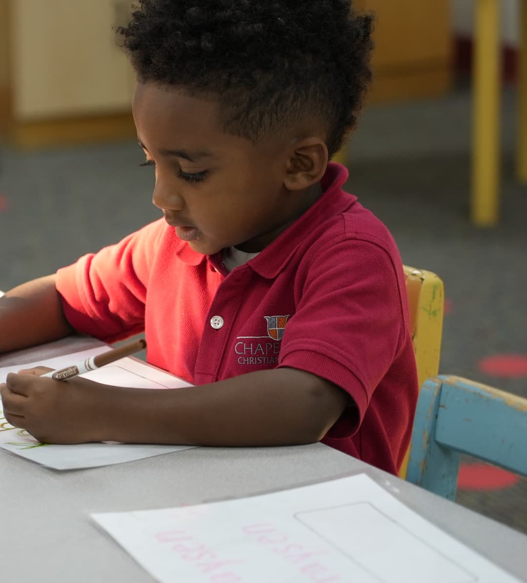 Student writing at Chapel Hill Christian School